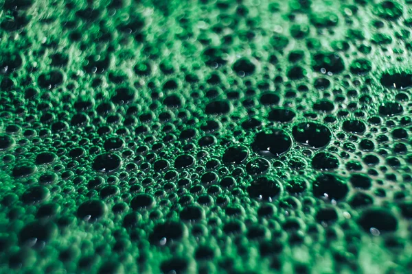 Beautiful green bubbles background . Macro view.