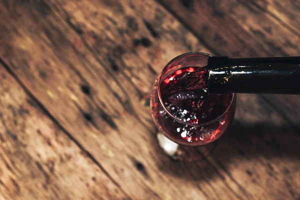 Pouring Red Wine Bottle Glass Wine Old Wooden Table — Stock Photo, Image
