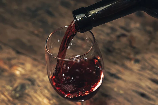 Pouring Red Wine Bottle Glass Wine Old Wooden Table — Stock Photo, Image