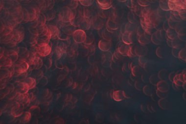 Koyu soyut arka planda güzel kırmızı bokeh.