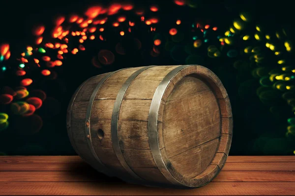 Old wooden barrel and wood table.  Beautiful light bokeh background.