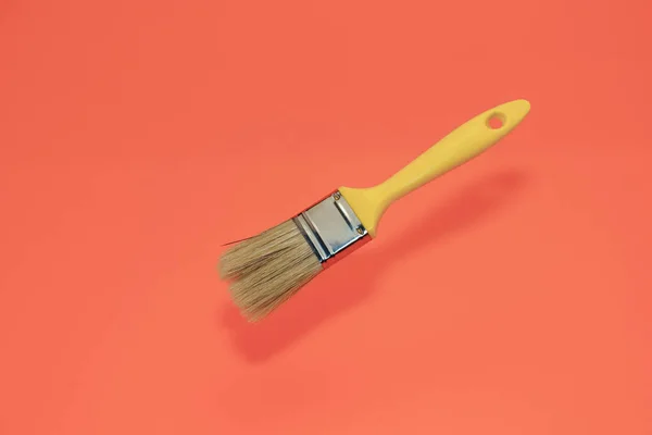 New Yellow Paint Brush Living Coral Background — Stock Photo, Image