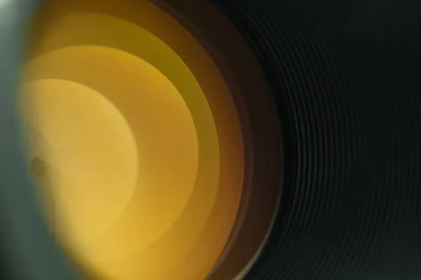 Beautiful Camera Lens Yellow Light Glass Black Background — Stock Photo, Image