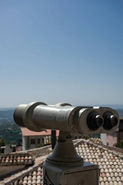 Binoculars look at the city with view city, closeup binocular on background viewpoint observe vision.