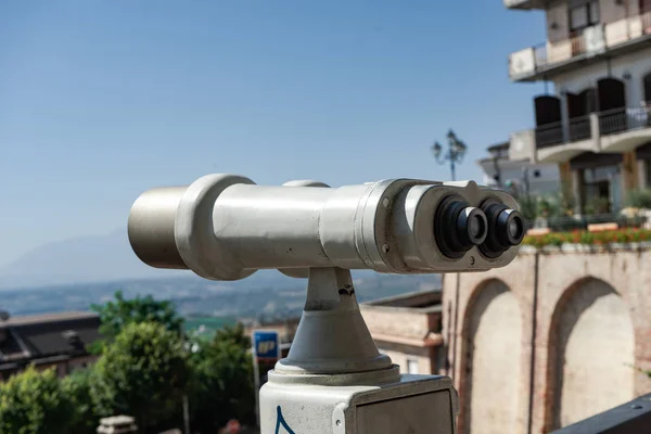 Binoculars look at the city with view city, closeup binocular on background viewpoint observe vision.