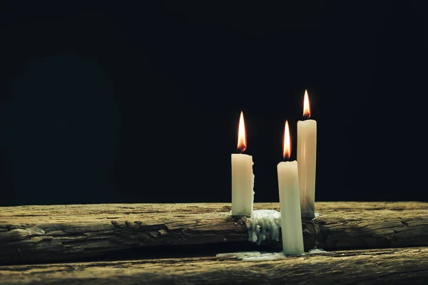 Beautiful Three White Burned Candles Old Oak Wooden Table Black — Stock Photo, Image