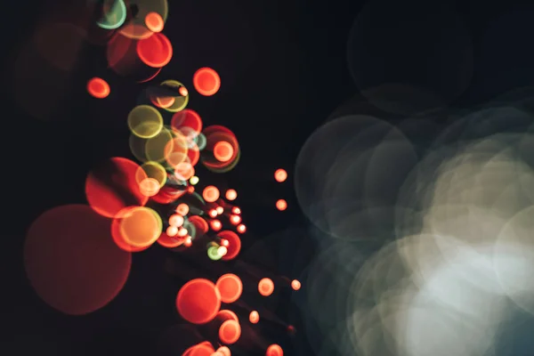 Beautiful red  abstract optical light bokeh in the darkness background.