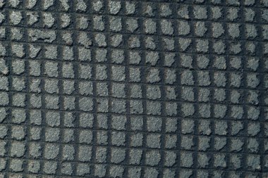 Izgara arkaplan dokusunda gri duvarı kapat. Makro görünüm.