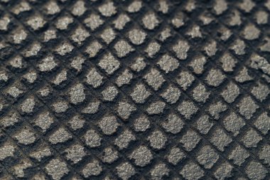 Izgara arkaplan dokusunda gri duvarı kapat. Makro görünüm.