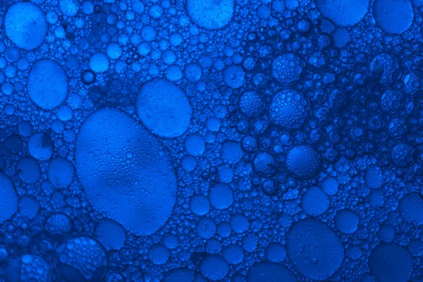 Close up beautiful abstract blue bubbles in water extreme. Abstract nature pattrn for design.