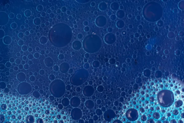 Beautiful abstraction blue water bubbles. Background pattern for design. Macro photography view.