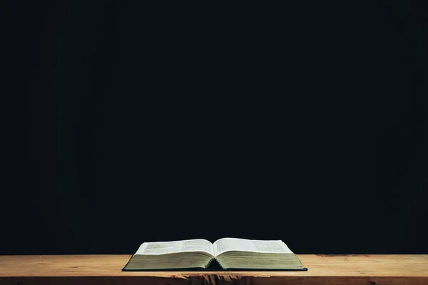 Open Holy Bible Red Old Wooden Table Beautiful Black Wall — Foto de Stock