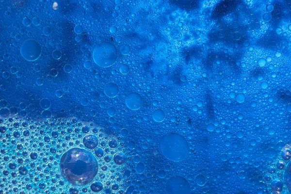 Beautiful abstraction blue water bubbles. Background pattern for design. Macro photography view.