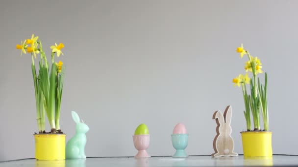 Boy steals an Easter egg, childish pranks. Curly cute schoolboy near the table with Easter decor. Easter traditions — Stock Video