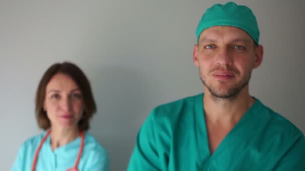 Male and female dentists. Close-up, look into the frame and smile. dental clinic — Stock Video