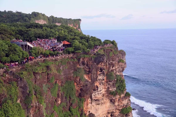 Hindu Temple Uluwatu - one of the six key temples - the spiritual pillars of Bali, Indonesia. Located on top of a steep cliff at 70 m above sea level. dedicated to the unity of trimurti (Shiva, Vishnu, Brahma), the beginning and end of the universe.