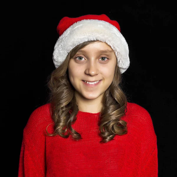 Une Jeune Fille Souriante Pull Rouge Chapeau Père Noël Regarde — Photo