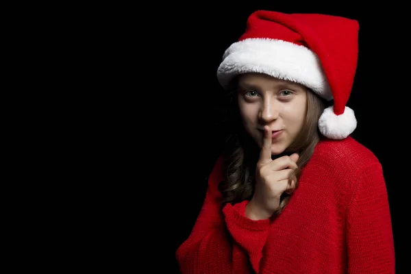 Feliz Navidad Chica Joven Suéter Rojo Sombrero Santa Sosteniendo Dedo — Foto de Stock