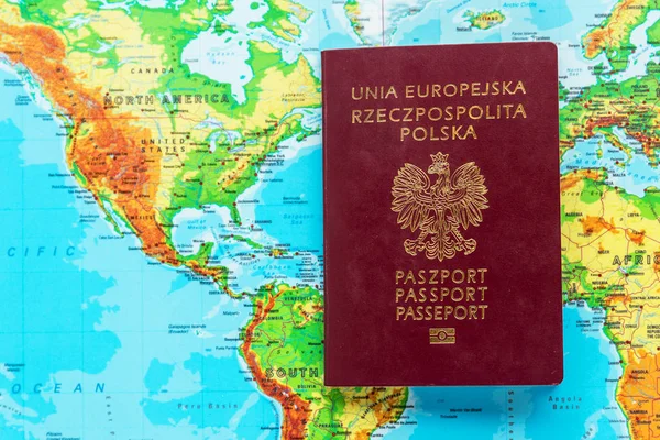 Passport of a citizen of Poland against the background of North America and South America. Poles immigration to America concept.