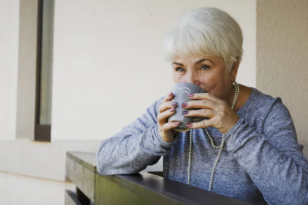 Beautiful Blonde Pensioner Woman Sitting Smiling Terrace Cup Tea Cookies — Stock Photo, Image