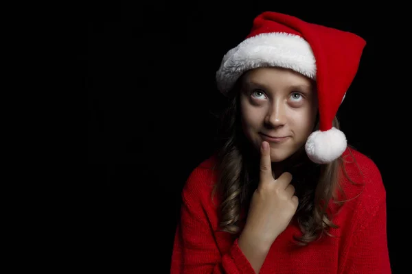 Feliz Navidad Chica Joven Suéter Rojo Gorra Santa Está Sonriendo — Foto de Stock
