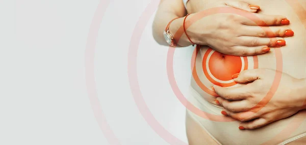 Acute pain woman in belly-ache, close-up isolated on a white background