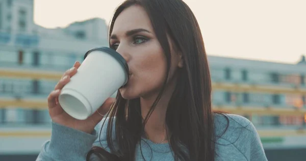 Pretty hipster girl with cup of coffee — Stock Photo, Image