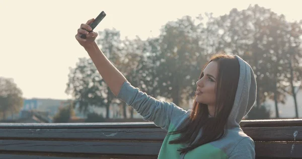 Beautiful young hipster stylish woman selfie in park — Stock Photo, Image