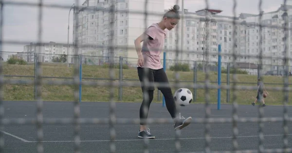 Girl practicing soccer skills and tricks — Stock Photo, Image