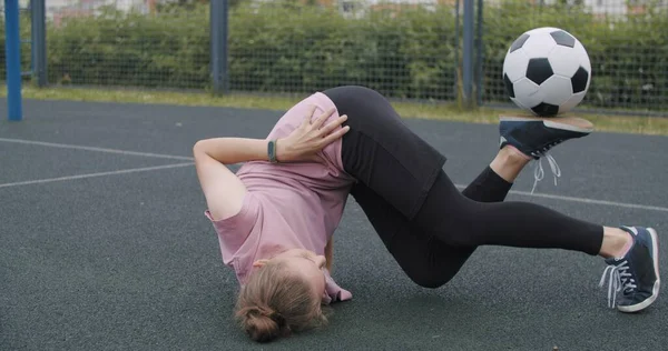 Girl practicing soccer skills and tricks — Stock Photo, Image