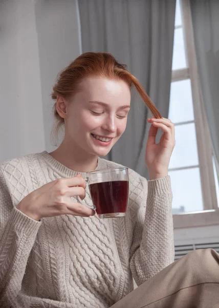 girl with tea smiling