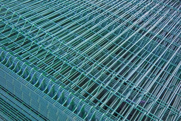 package of galvanized steel panels for the fence with a powder coated green color