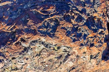 Kahverengi taş duvar kaya doku arka plan yakın çekim.