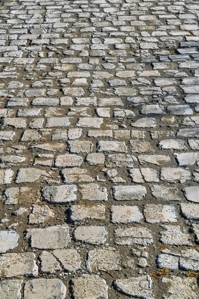 Textura do pavimento de pedra. Granito calhau apedrejado pavimento fundo . — Fotografia de Stock