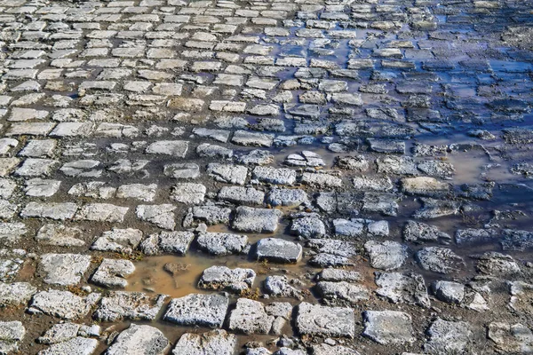 Textura pavimento de piedra. Granito adoquín empedrado pavimento fondo . — Foto de Stock