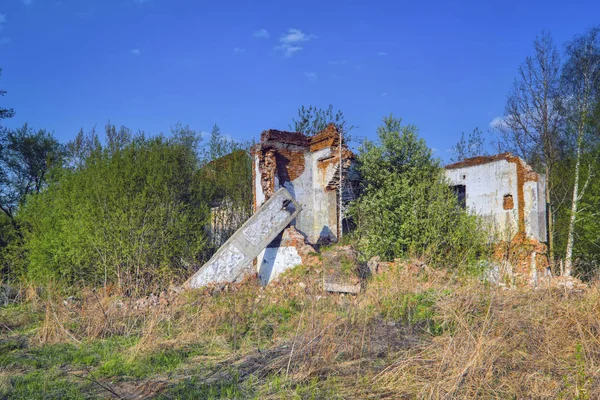 Old abandoned collapsing building. Landscape with the ruins of the old buildings.