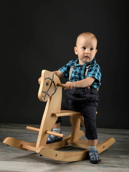 Sweet Little Boy Playing Home Wooden Horse Childhood Games — Stock Photo, Image