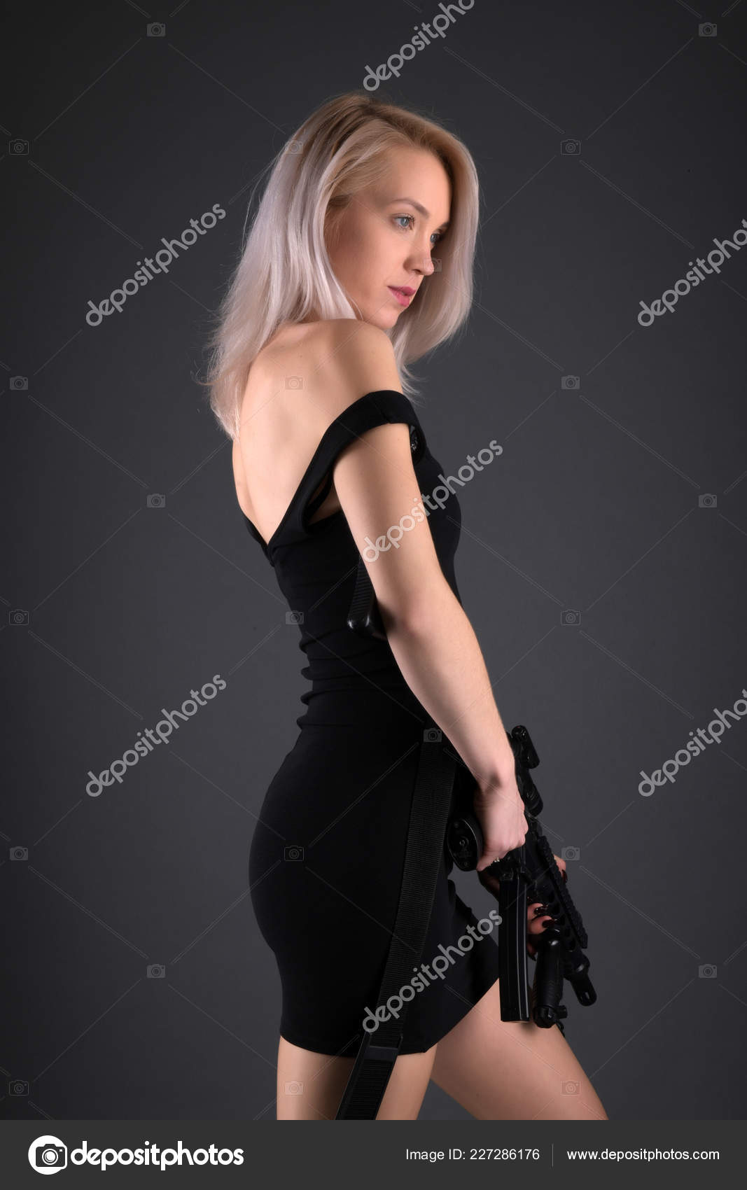 Fashion Studio Photo Gorgeous Blonde Woman Gun Stock Photo by ©muro