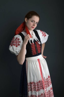 Young beautiful slovak woman in traditional costume  clipart