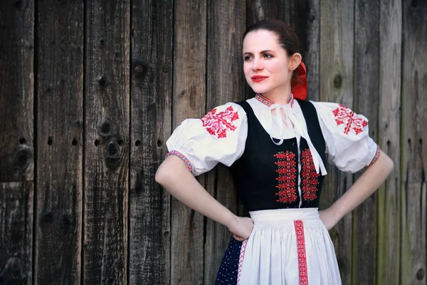 Young beautiful slovak woman in traditional dress. Slovak folklore