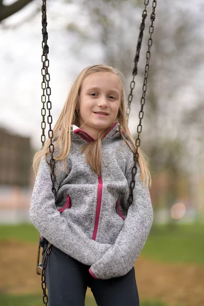 Little Smiling Girl Swing Outdoors — Stock Photo, Image