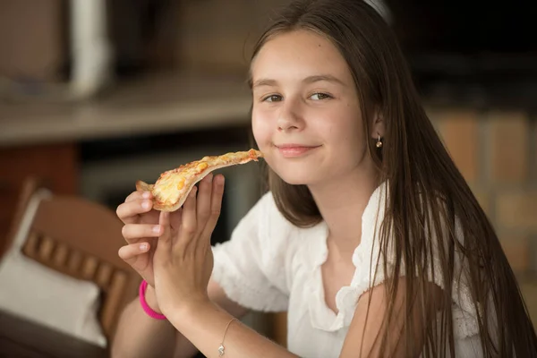 Young Girl Eating Piece Pizza — Zdjęcie stockowe