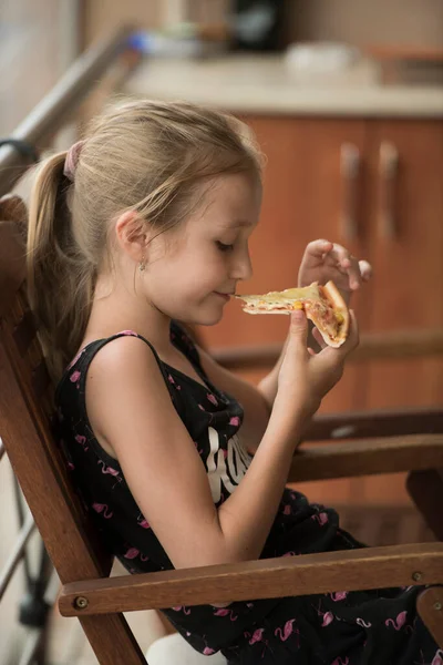Young Girl Eating Piece Pizza — Stok fotoğraf