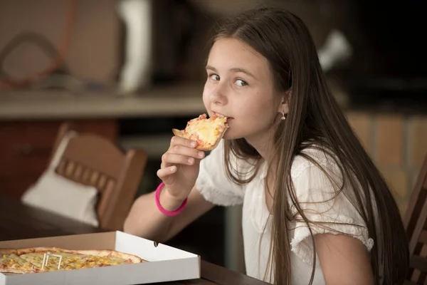 Young Girl Eating Piece Pizza — Stok fotoğraf
