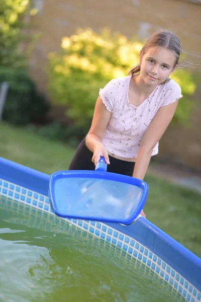 Beautiful Young Girl Cleaning Pool — Stock Photo, Image