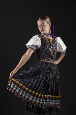Young beautiful slovak woman in traditional costume. Slovak folklore. clipart