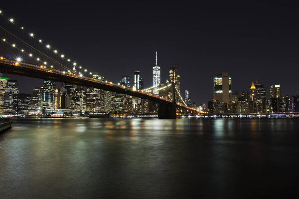 Night panorama of Manhattan with a bridge