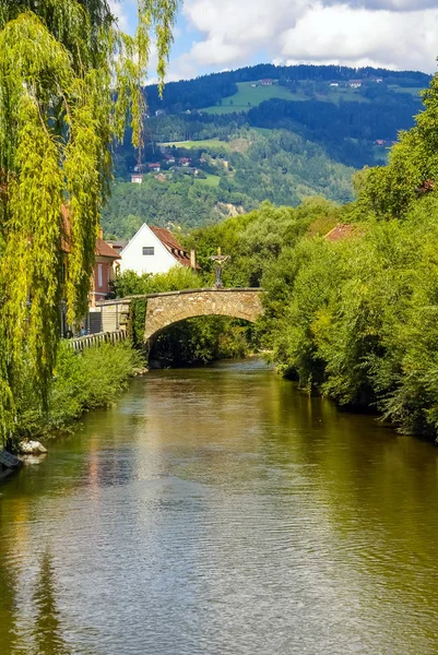 Old village in Austria, and  old bridge over a river