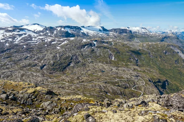 Panorama of summer landscape in Norway near Geiranger fiord - river, stones, mountings