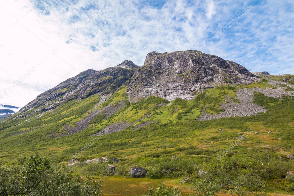 Panorama of summer landscape in Norway near Geiranger fiord - river, stones, mountings